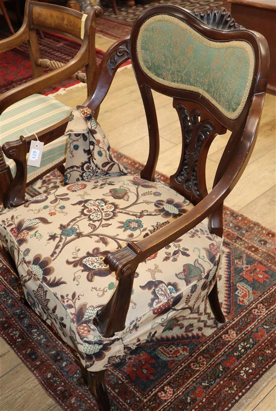 A late Victorian mahogany elbow chair, with rose branch upholstery